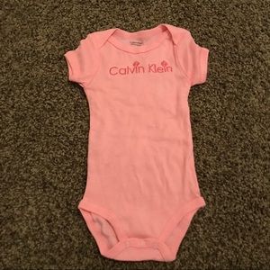 Pink Calvin Klein onesie